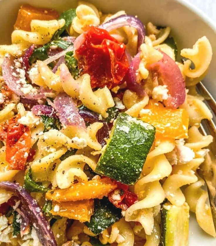 Baked feta pasta served with fresh basil and cherry tomatoes