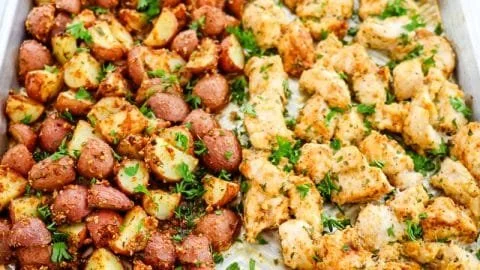 Delicious Baked Garlic Parmesan Chicken served with crispy roasted potatoes.