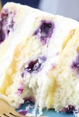 Delicious homemade Lemon Blueberry Cake with fresh blueberries and lemon zest