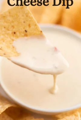 Delicious bowl of homemade Mexican white cheese dip served with tortilla chips