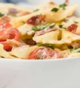 Colorful BLT Pasta Salad with tomatoes, lettuce, and crispy bacon.