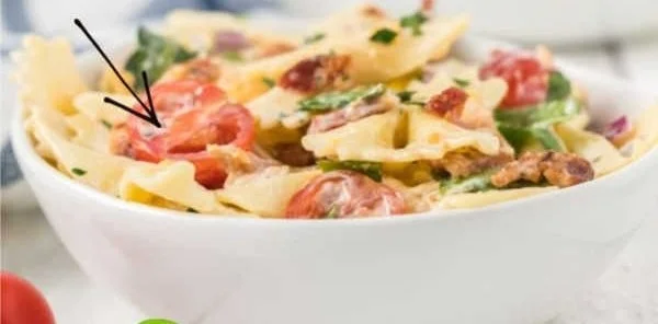 Colorful BLT Pasta Salad with tomatoes, lettuce, and crispy bacon.