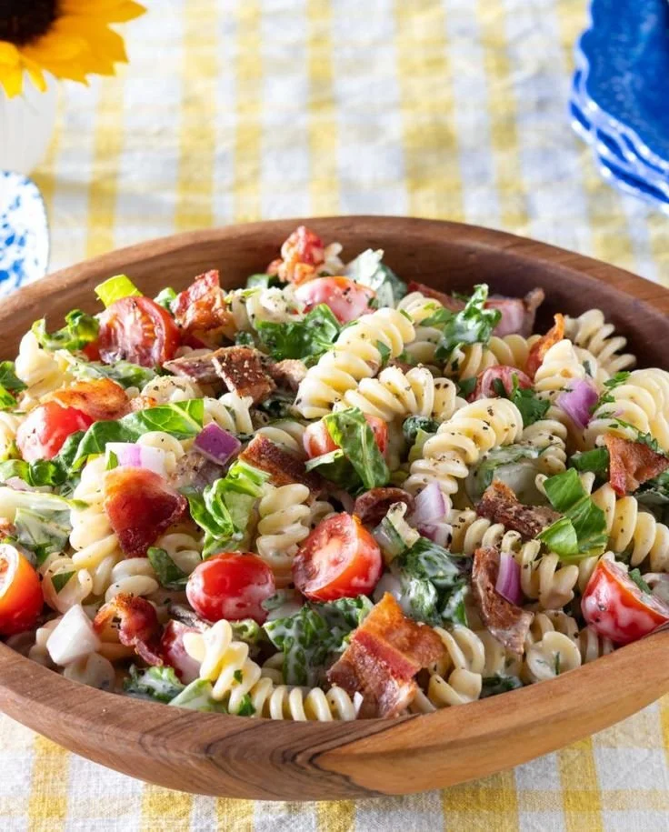 Colorful BLT Pasta Salad with bacon, lettuce, and tomatoes in a serving bowl