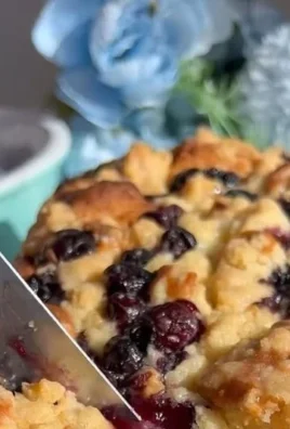 Freshly baked Blueberry Lemon Loaf with blueberries and lemon zest