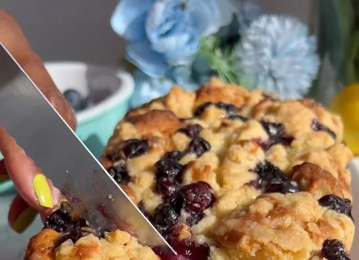 Freshly baked Blueberry Lemon Loaf with blueberries and lemon zest