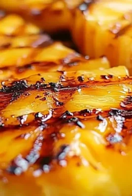 Delicious brown sugar grilled pineapple slices on a barbecue grill