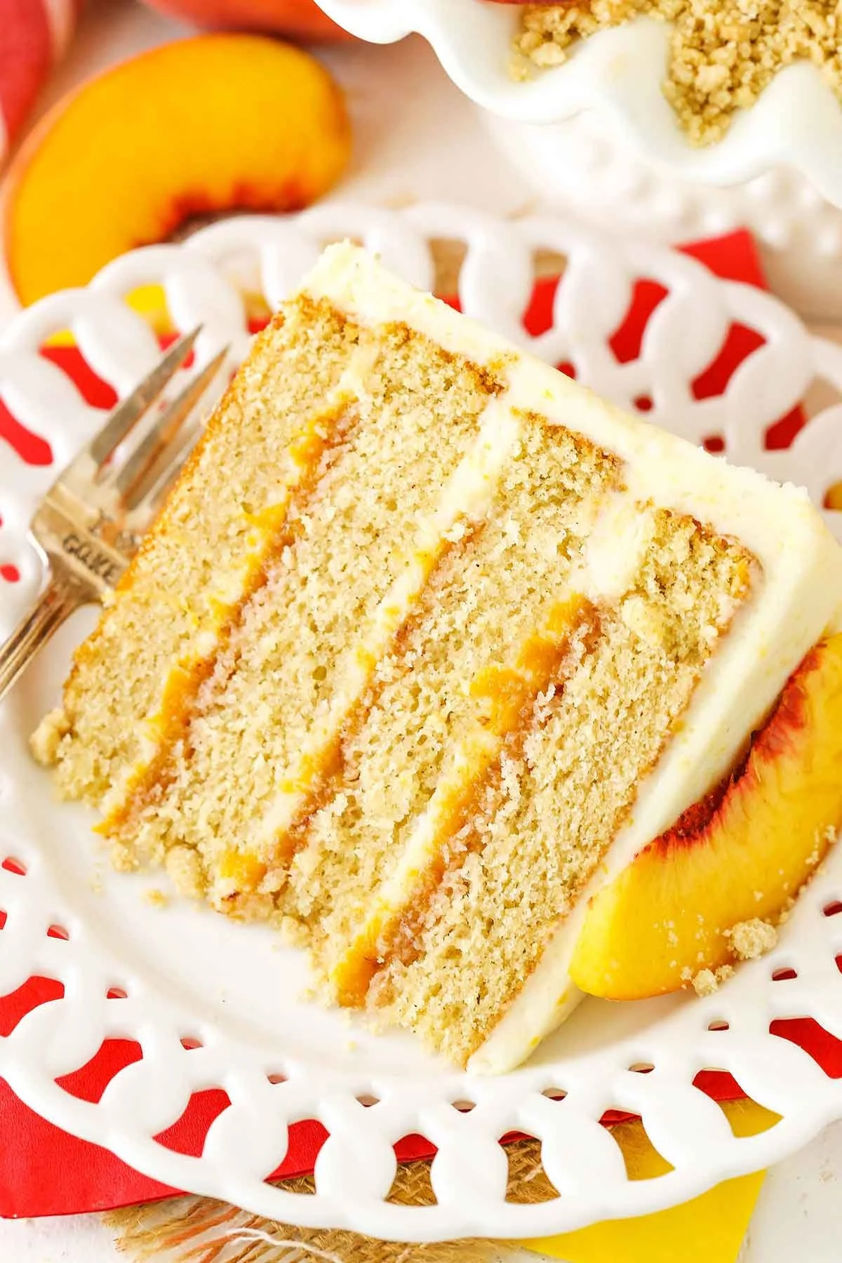 Brown sugar layer cake with peach filling on a decorative plate