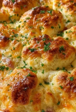 Chicken Biscuit Bake Casserole with bubbly cheese and flaky biscuits