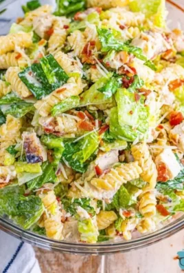 Healthy Chicken Caesar Pasta Salad with grilled chicken, romaine, and Caesar dressing.