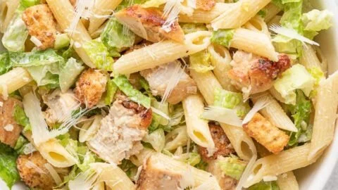 Bowl of Chicken Caesar Pasta Salad with chicken, romaine, and Caesar dressing