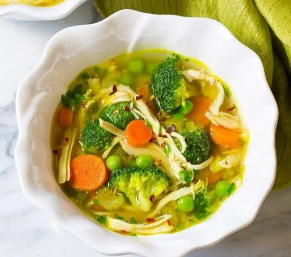 Delicious Chicken Detox Soup in a bowl, packed with healthy ingredients.