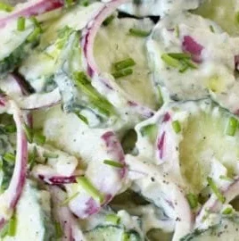 Creamy cucumber yogurt salad with fresh herbs and vegetables