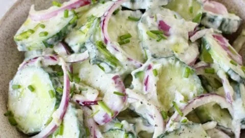 Creamy cucumber yogurt salad with fresh herbs and vegetables