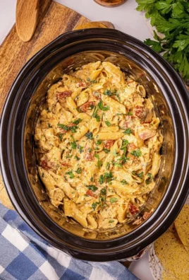 Crockpot Marry Me Chicken Pasta served with fresh parsley and ingredients