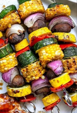 Easy grilled vegetable skewers with colorful veggies on a BBQ grill.