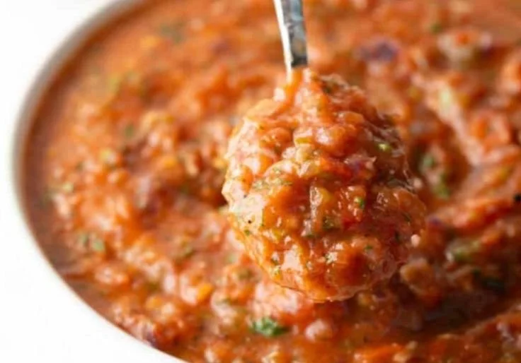 Bowl of easy roasted salsa with fresh ingredients and bright colors