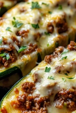 Ground Beef Stuffed Zucchini Boats ready to serve on a plate