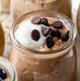 High protein overnight oats with protein powder in a glass bowl