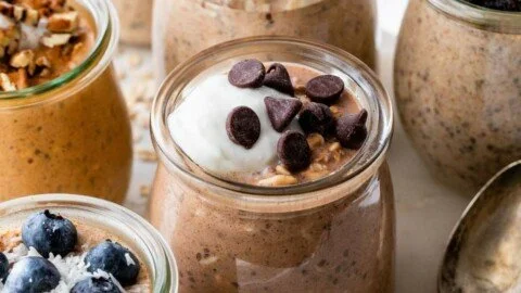 High protein overnight oats with protein powder in a glass bowl