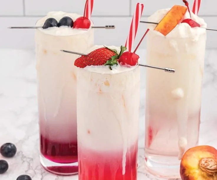 Refreshing glass of Italian Cream Soda with whipped cream and cherry on top
