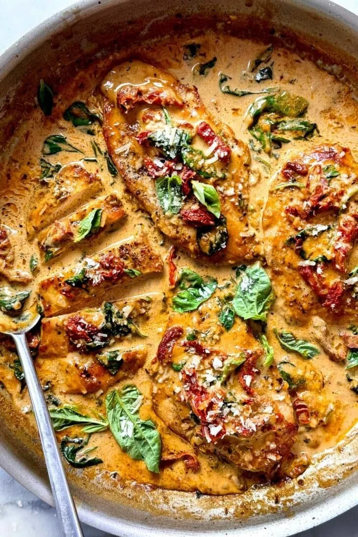 Delicious plate of Marry Me Chicken with creamy sauce and herbs