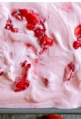 Delicious no churn strawberry ice cream served in a bowl with fresh strawberries