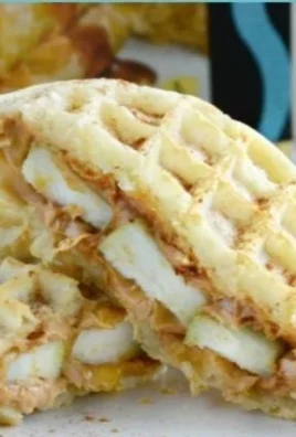 Delicious peanut butter apple waffle sandwiches stacked on a plate