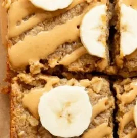 Peanut Butter Banana Baked Oatmeal served in a bowl with fresh banana slices
