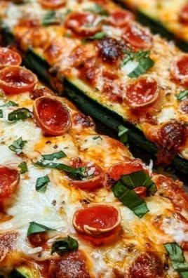 Healthy Pizza Zucchini Boats topped with cheese, vegetables, and sauce