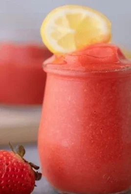 Refreshing frozen strawberry lemonade served in a cup