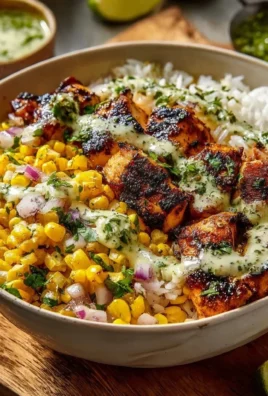 Delicious street corn chicken rice bowls topped with fresh ingredients.