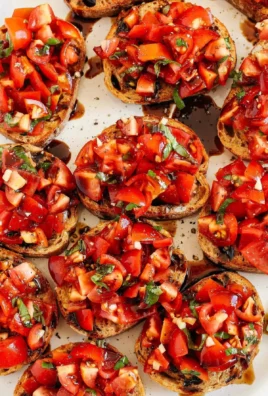 Delicious Tomato Basil Bruschetta served on toasted bread with fresh ingredients.