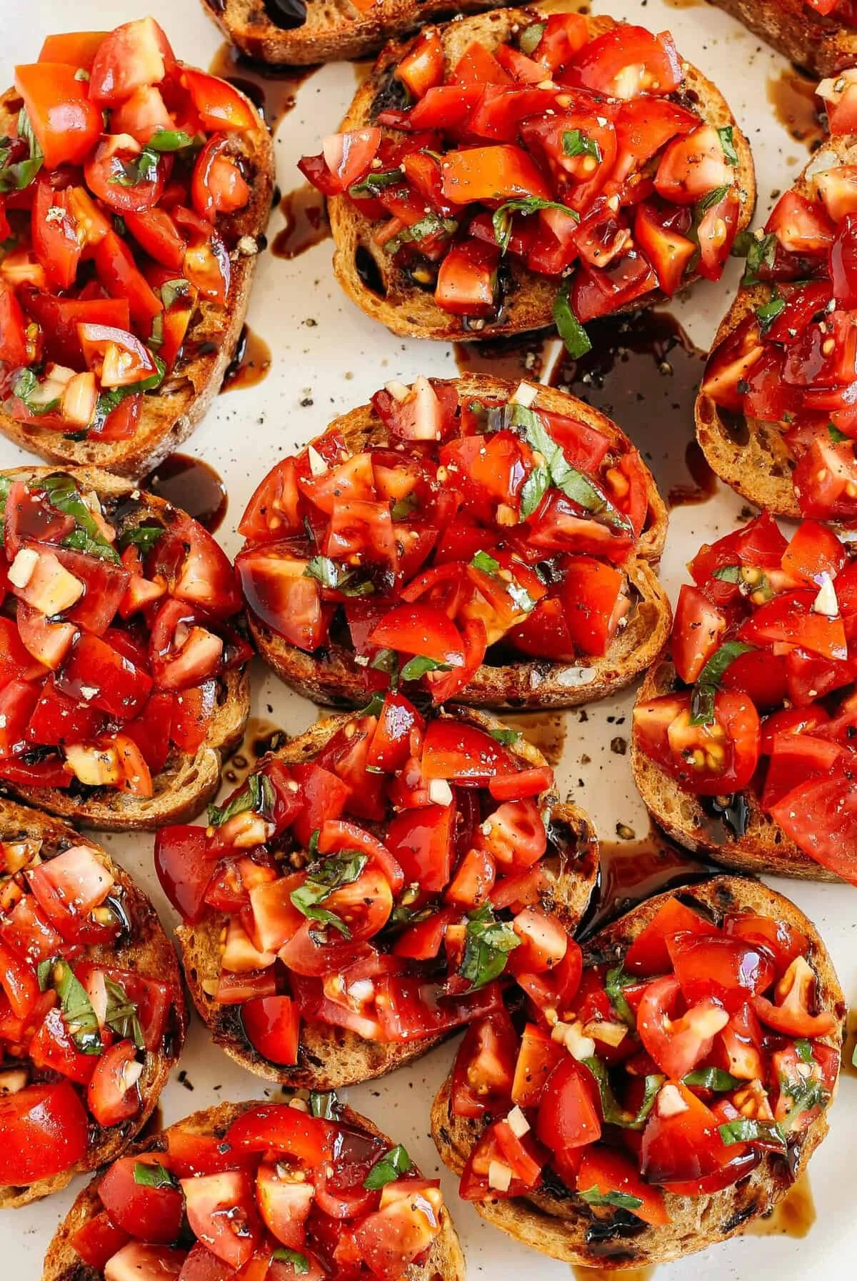 Delicious Tomato Basil Bruschetta served on toasted bread with fresh ingredients.