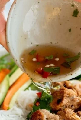 Delicious Vietnamese noodle bowl with tender lemongrass chicken and fresh herbs