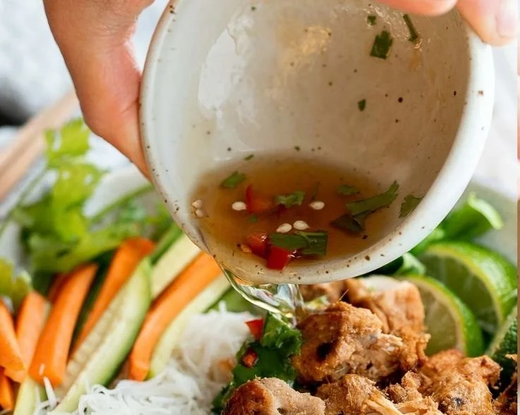 Delicious Vietnamese noodle bowl with tender lemongrass chicken and fresh herbs