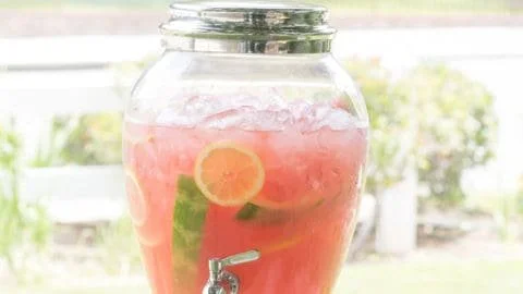Refreshing watermelon lemonade served in a glass with fresh mint leaves.